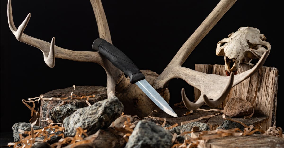 knife on the background of a deer horn